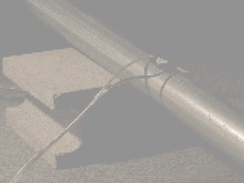 home image, my work photo. A steel pipe is placed on a concrete block, and a vibration speaker is attached to the pipe.